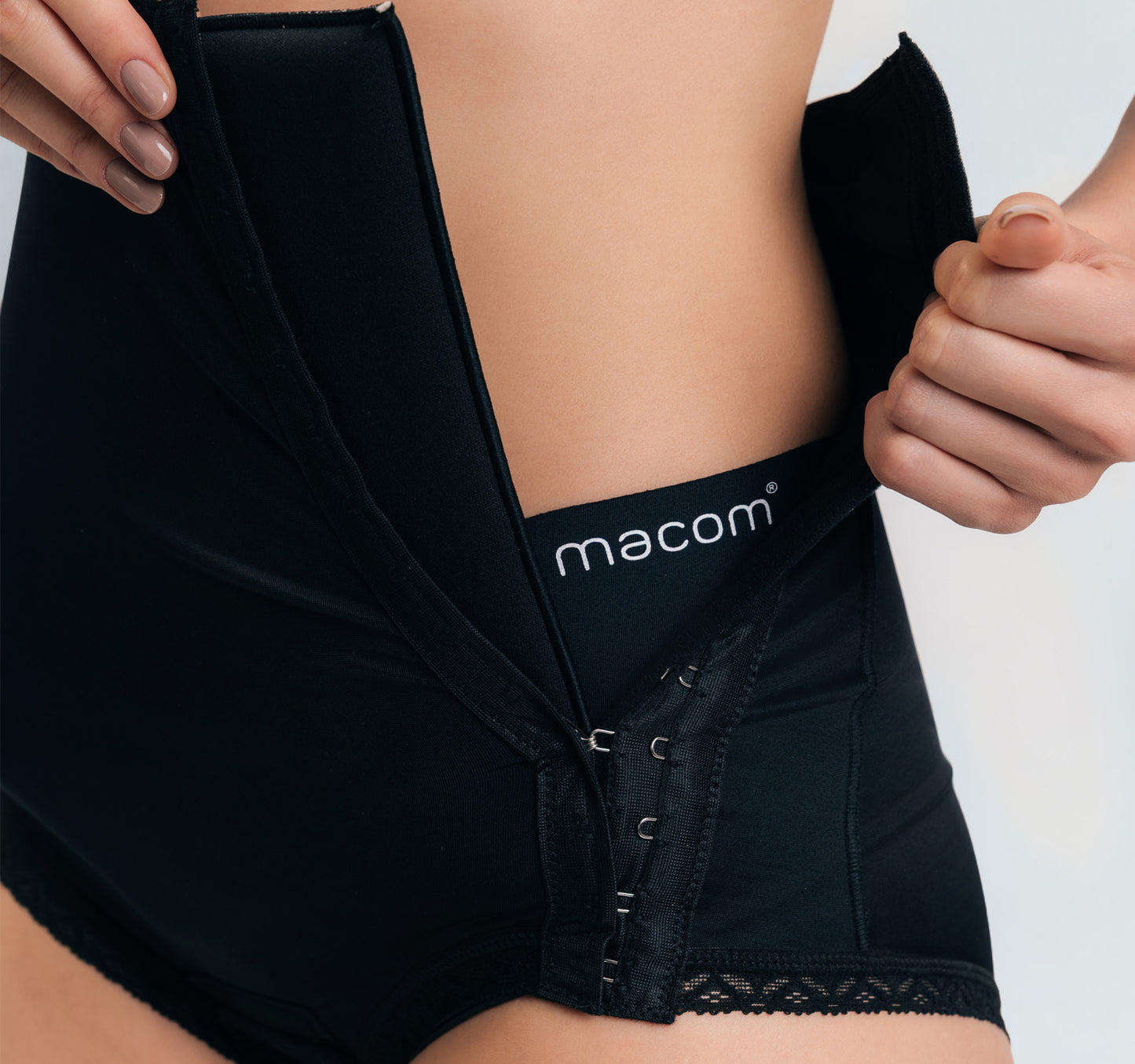 Side fastening girdle with removable insert