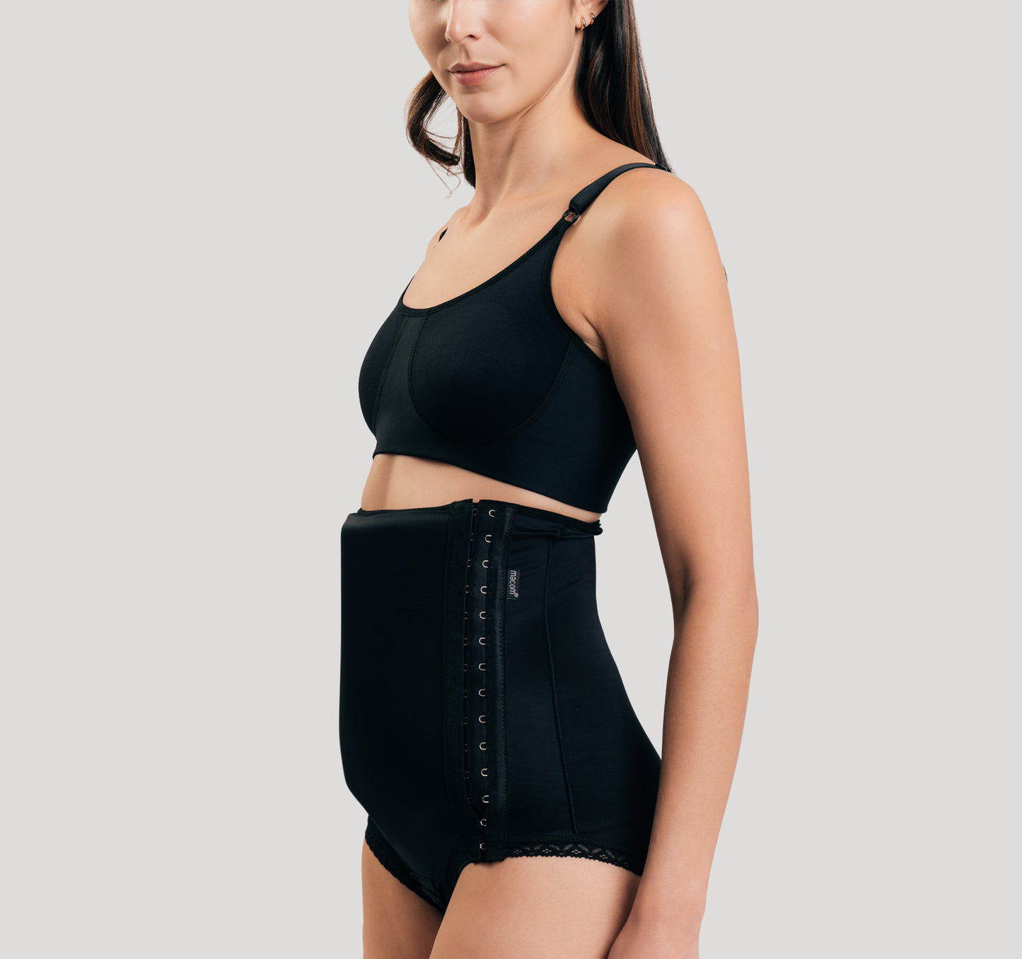 Side fastening girdle with removable insert